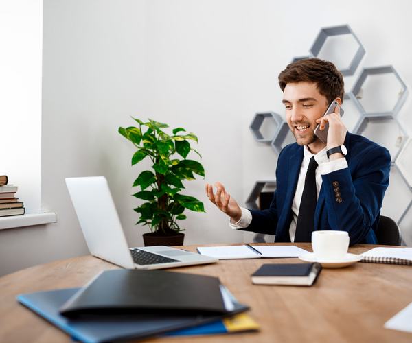 wp:7332 young-successful-businessman-speaking-phone-office-background-scaled.jpg